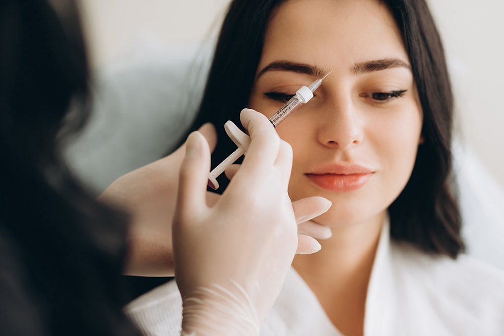 Close-up of a woman receiving a Nuceiva injection.