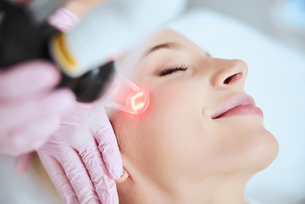 Laser resurfacing treatment being performed on a woman’s face for smoother, radiant skin.